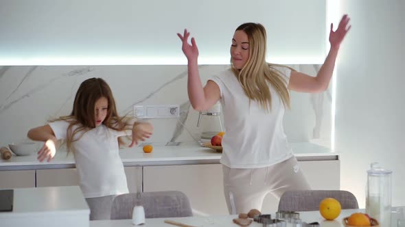 Happy Family in the Modern White Kitchen