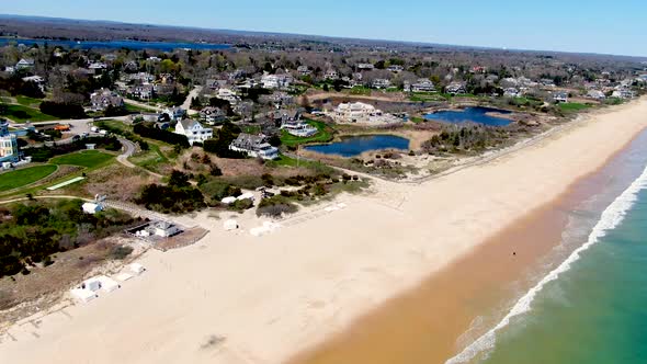 Luxury town of Westerly, RI near vibrant ocean and sandy beach, aerial view
