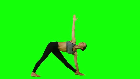 Woman Doing Yoga in Sports Clothes. Green Screen