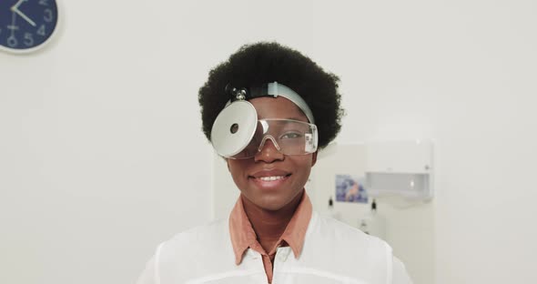 Close Up Of African American Happy Beautiful Woman Physician Smiling To Camera