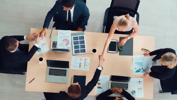 Group Business People Handshake at Meeting Table