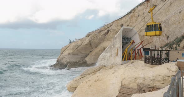 Rosh Hanikra view with sea, rocks and moving cable car