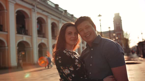 Happy Smiling Young Couple on City Street.