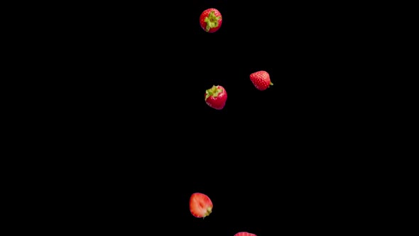 Strawberry Fruits Fall on a Black Background