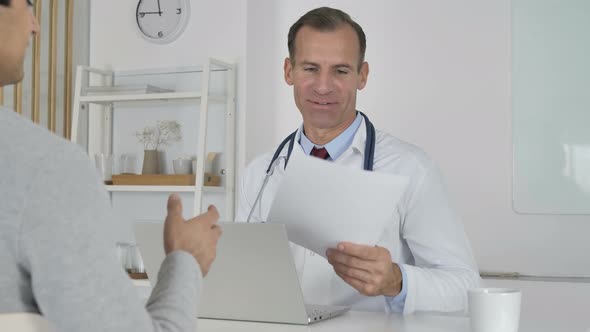 Doctor Sharing Medical Report with Patient, Positive Results