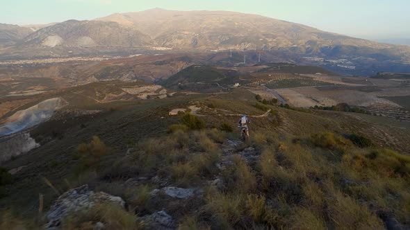 Off Road Motocross Biker in a Mountainous Landscape