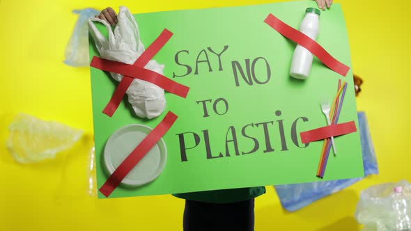 Girl Activist Holding Green Poster Say No To Plastic. Plastic Nature Pollution