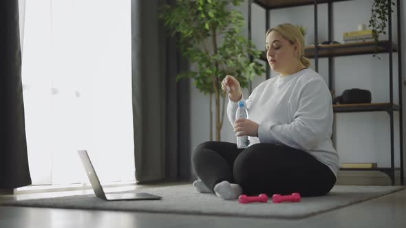 Woman Drinking Water After Sport