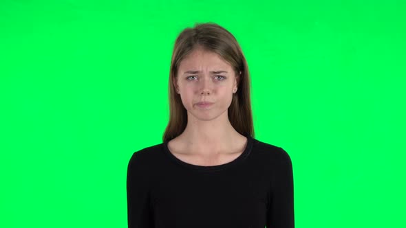 Young Woman Is Upset. Green Screen