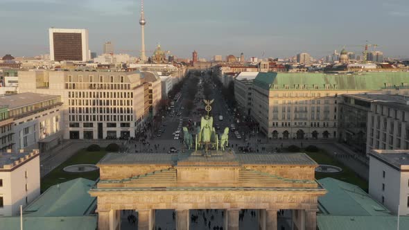 AERIAL: Slowly Approaching Brandenburg Gate and Tiergarten in Beautiful Sunset Sunlight with Close