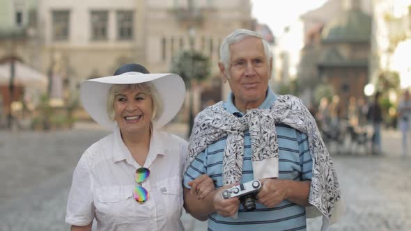 Senior Two Tourists Walking in Town Center. Traveling in Lviv, Ukraine