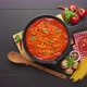 Cooking homemade spaghetti with tomato sauce in cast iron pan  - VideoHive Item for Sale