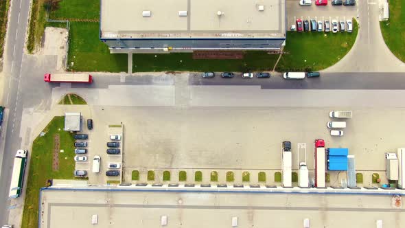 Aerial view of logistics center, warehouses near the highway. Delivery center Traffic