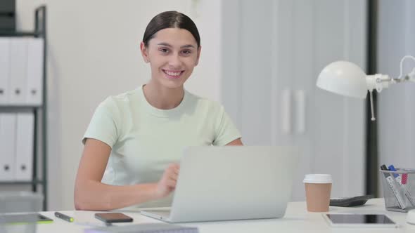 Young Latin Woman with Laptop Showing Thumbs UP