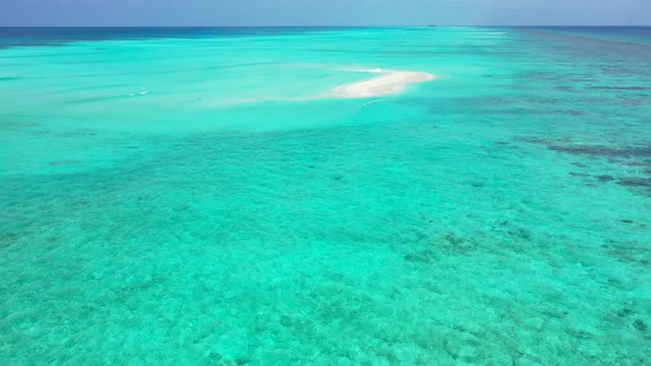 Natural above abstract shot of a paradise sunny white sand beach and aqua blue water background in h