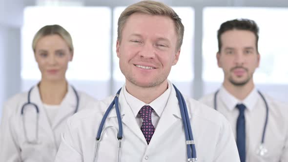 Portrait of Cheerful Team of Doctors Doing Video Chat