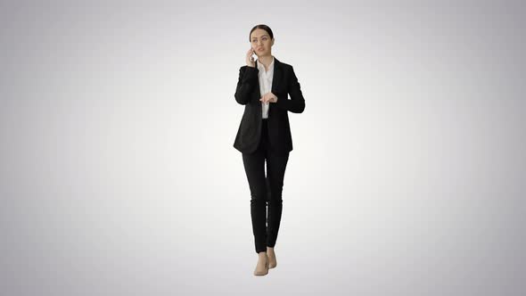 Bossy Businesswoman Talking on Her Phone on Gradient Background