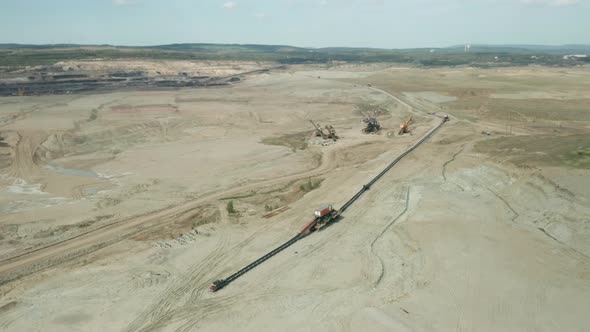 Flight Over a Mining Quarry with Equipment for Coal Mining. Working Bucket Wheel Excavator. 