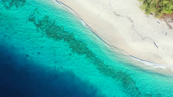 Aerial scenery of exotic coast beach trip by blue ocean with clean sand background of journey near s