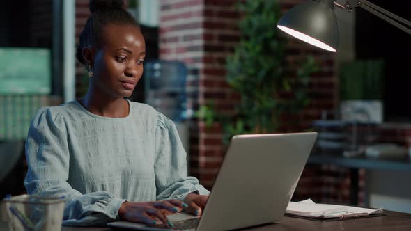 Portrait of Sales Assistant Working on Laptop to Create Capital Profit