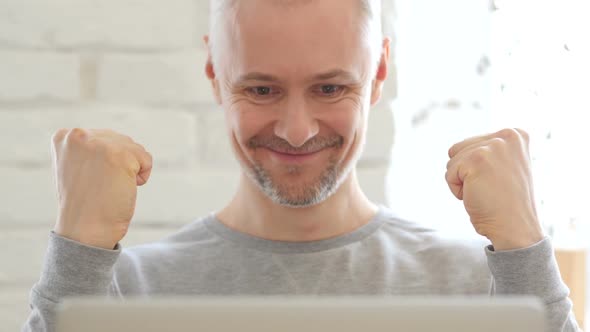 Middle Aged Man Excited for Success at Work, Front View