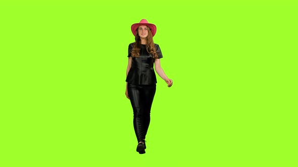 Adorable Young Woman in Black Leather Jacket Walks on Green Background, Chroma Key