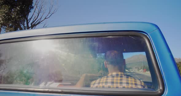 Young couple on a road trip in their pick-up truck