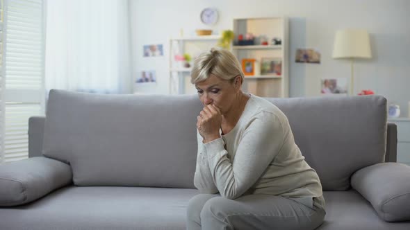 Depressed Aged Woman Sitting Alone at Home, Difficult Time, Breakup Sorrow