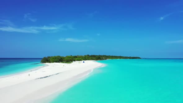 Aerial panorama of idyllic tourist beach wildlife by blue ocean with white sandy background of a pic