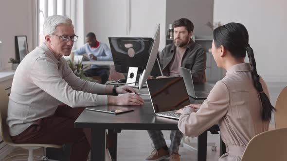 Colleagues Working in Office