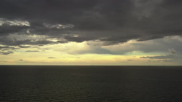 Lateral Aerial Storm Clouds Over Ocean 4k 60p Video