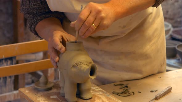 Potter working on clay sculpture