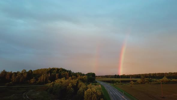 Dark Thunderstorm Clouds and Double Rainbow Over Forest and Wheat Field, Areal Dron Shoot.