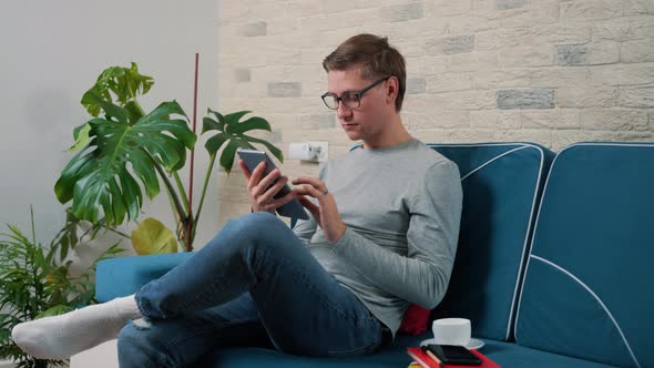 Young Man Working with Tablet Pc Computer Lifestyle Concept