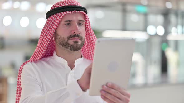 Arab Businessman Using Digital Tablet Browsing Internet