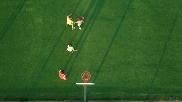 Kids Playing Basketball in The Stadium