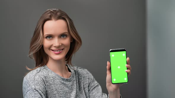 Cheerful Lady Demonstrate Mobile Phone Green Screen Chroma Key Smartphone