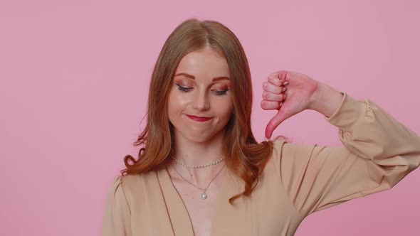 Upset Girl in Beige Blouse Showing Thumbs Down Sign Gesture Disapproval Dissatisfied Dislike