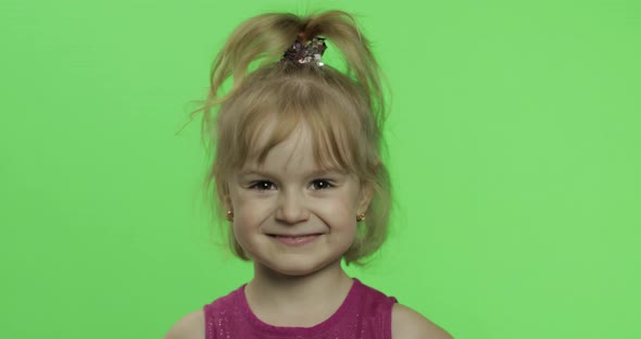 Child Portrait in Purple Dress. Happy Girl Making Fly Kisses. Chroma Key