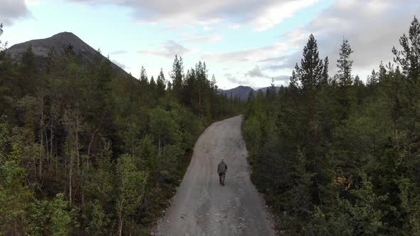 A Lonely Man Walks Down the Road