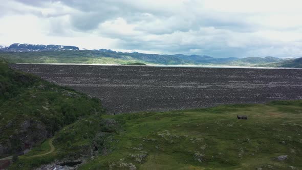 Hydroelectric water reservoir - Slowly rotating and ascending aerial revealing water level inside da