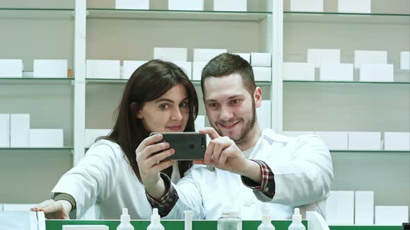 Smiling Two Pharmacist Taking Selfie in Pharmacy