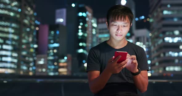 Man use of mobile phone in city of Hong Kong