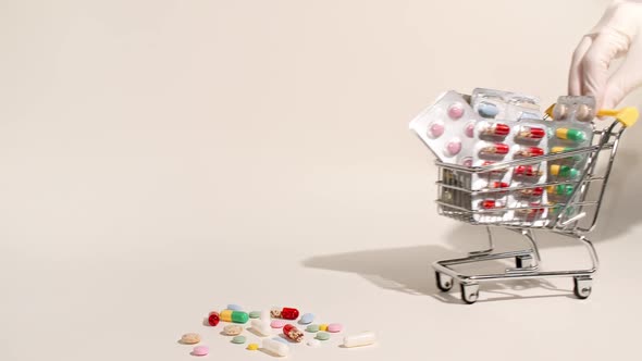 Closeup of Different Medical Pills in the Basket on Beige Background