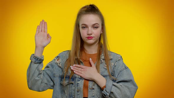 Sincere Responsible Teen Girl Raising Hand to Take Oath Promising to Be Honest and to Tell Truth