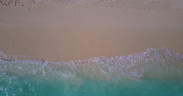 Wide angle drone copy space shot of a summer white paradise sand beach and blue sea background 