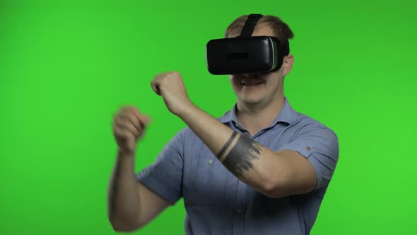 Man Using VR Headset Helmet To Play Game. Watching Virtual Reality 3d 360 Video. Chroma Key