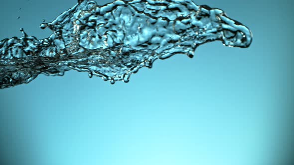 Super Slow Motion Shot of Water Splash at 1000Fps on Blue Gradient Background