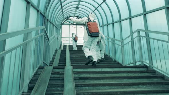 Disinfectors Are Sanitizing Covered Staircase