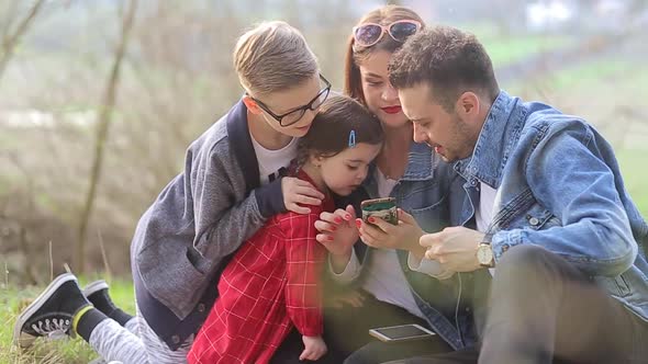 Family on vacation for a picnic with a fire